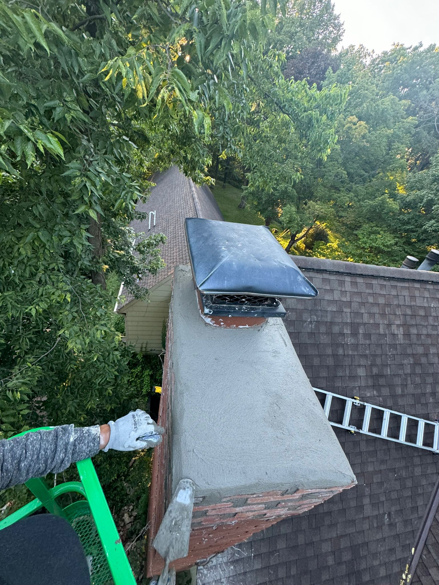 JB Chimney Services performing a detailed masonry tuckpointing and restoration on a historic chimney in St. Paul, MN.